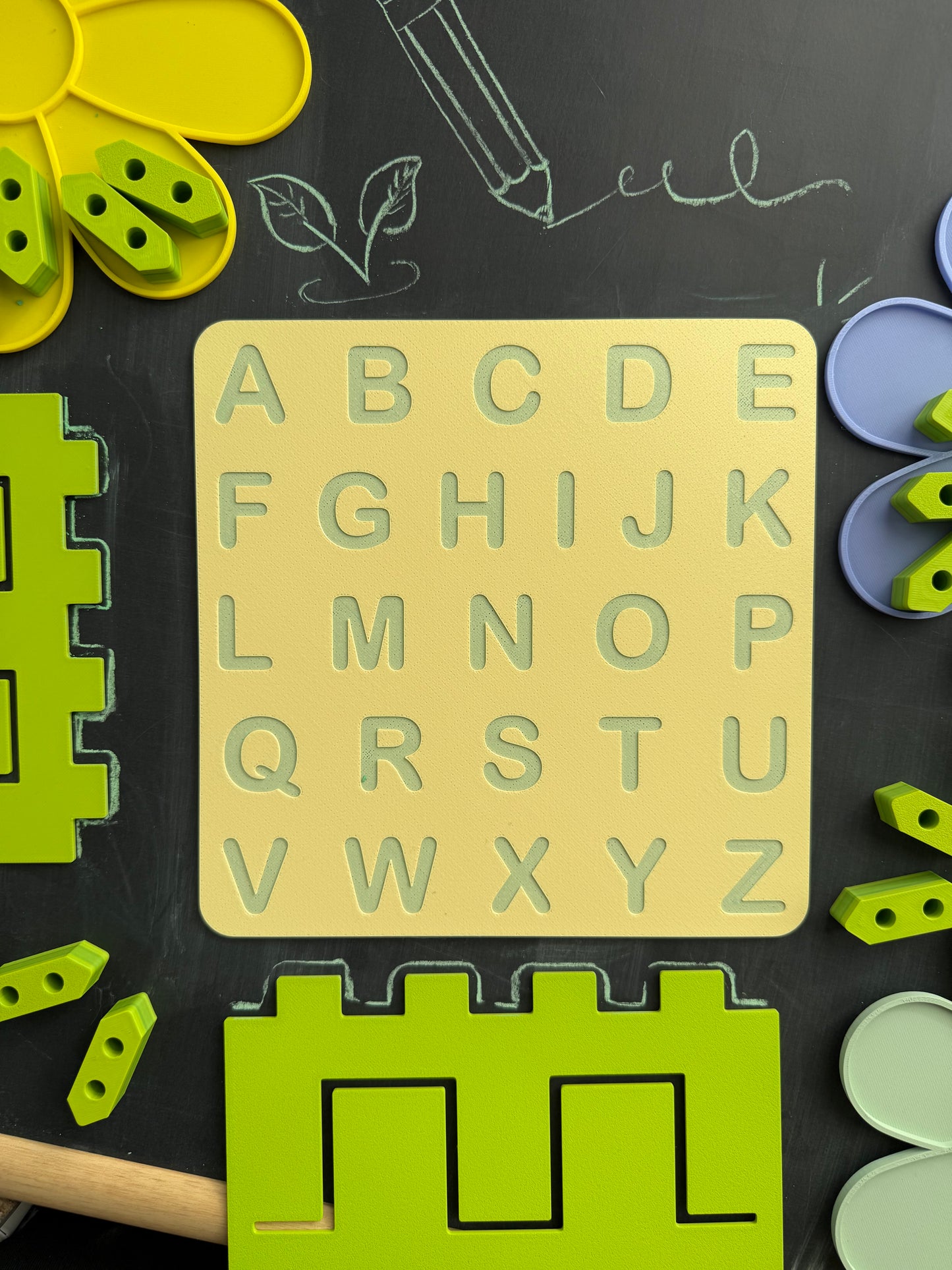 Top view of a 3D printed alphabet tracing board with uppercase letters, designed for Montessori-inspired pre-writing practice and fine motor skill devepment